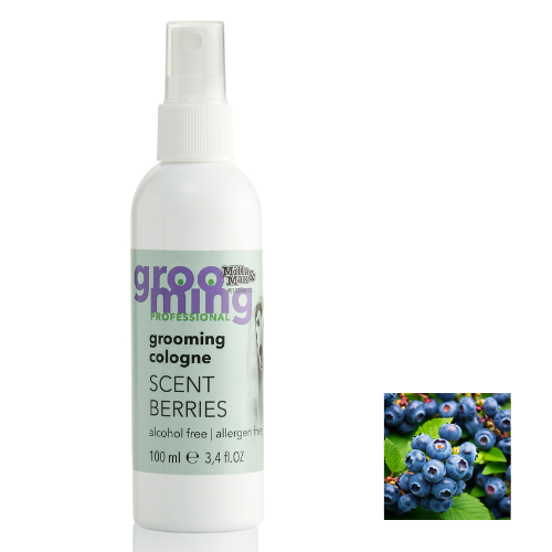 A bottle of Organic Berries Dog Cologne next to a photo of Blueberries